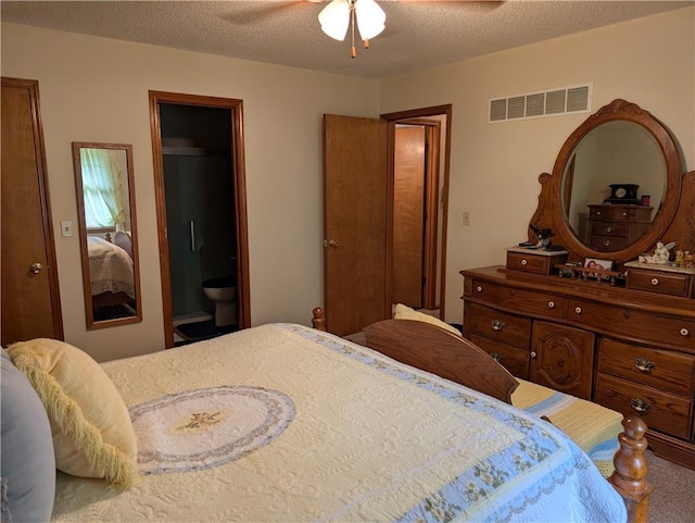 413 Quail Trl, Warrensburg, MO 64093 - carpeted bedroom featuring ensuite bathroom, a textured ceiling, and ceiling fan