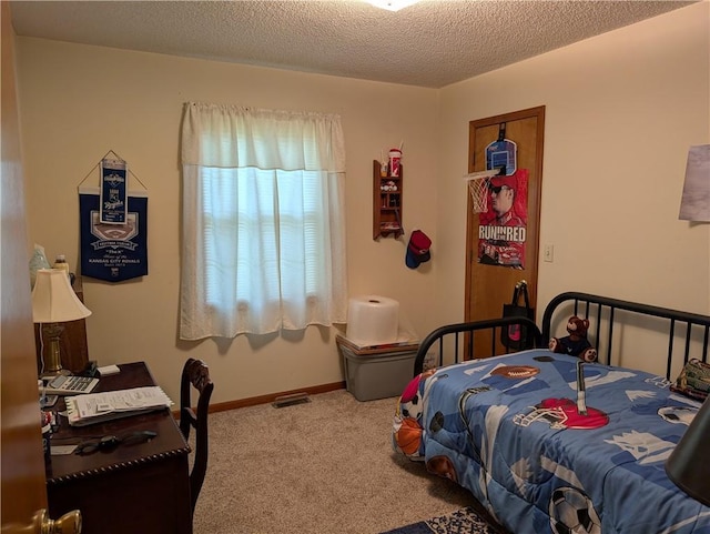 413 Quail Trl, Warrensburg, MO 64093 - carpeted bedroom featuring a textured ceiling and baseboards