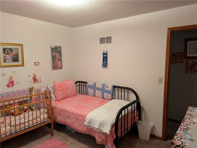 413 Quail Trl, Warrensburg, MO 64093 - carpeted bedroom featuring a textured ceiling