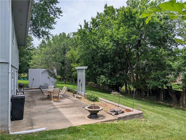 413 Quail Trl, Warrensburg, MO 64093 - view of patio featuring a fire pit and outdoor dining space