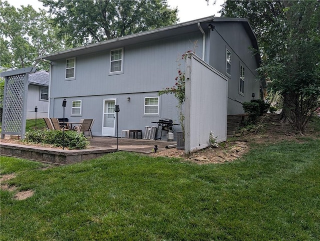 413 Quail Trl, Warrensburg, MO 64093 - rear view of property with a patio area and a yard