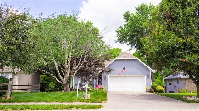 413 Quail Trl, Warrensburg, MO 64093 - obstructed view of property with concrete driveway and a garage