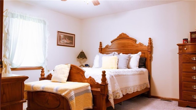 413 Quail Trl, Warrensburg, MO 64093 - bedroom featuring carpet floors and a ceiling fan
