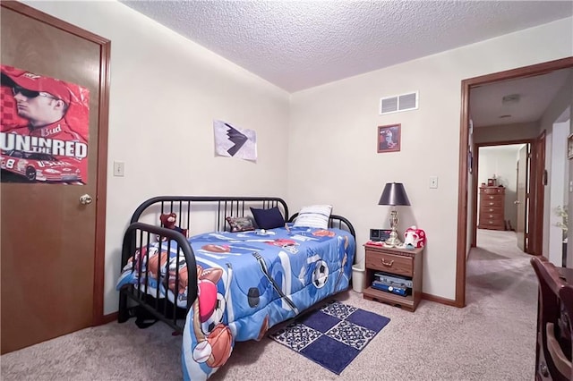 413 Quail Trl, Warrensburg, MO 64093 - bedroom with carpet and a textured ceiling