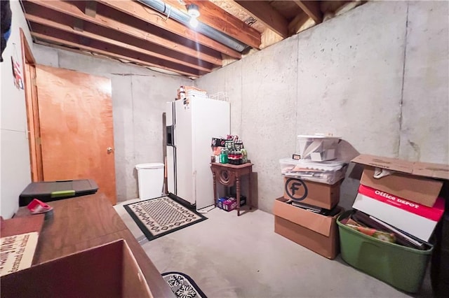 413 Quail Trl, Warrensburg, MO 64093 - unfinished below grade area featuring white refrigerator with ice dispenser