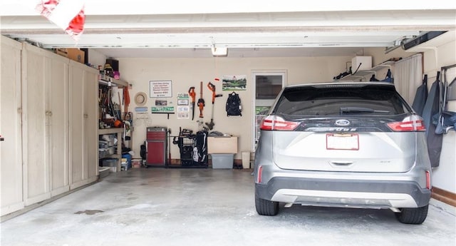 413 Quail Trl, Warrensburg, MO 64093 - garage featuring a garage door opener