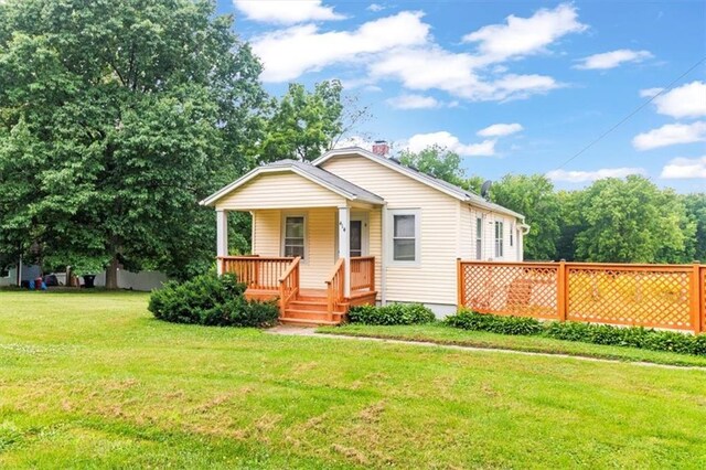 414 Dickinson Rd, Independence, MO 64050 - view of front of home featuring covered porch and a front lawn