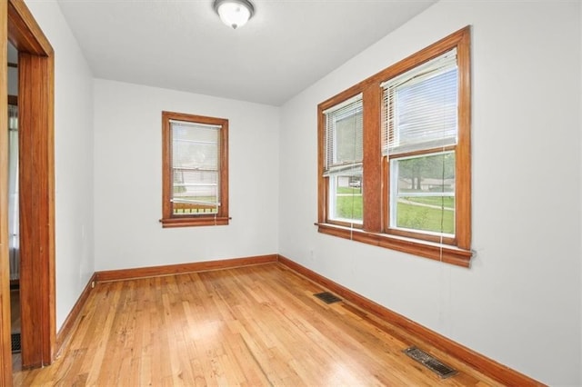 414 Dickinson Rd, Independence, MO 64050 - empty room with baseboards and light wood finished floors