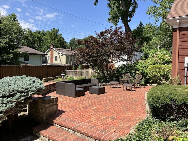 207 W 66th St, Kansas City, MO 64113 - fenced backyard with an outdoor living space and a patio area