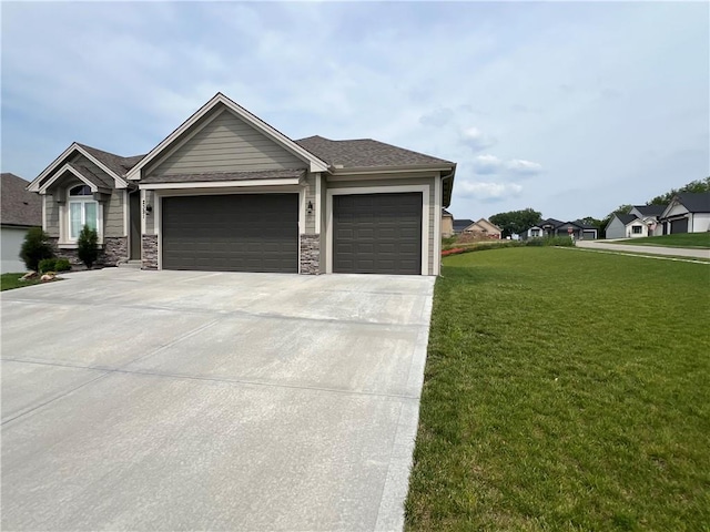 2321 Dovecott Dr, Kearney, MO 64060 - view of front of property featuring an attached garage, a front lawn, driveway, and stone siding