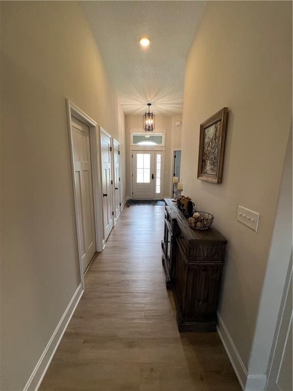 2321 Dovecott Dr, Kearney, MO 64060 - doorway featuring a chandelier, light wood finished floors, and recessed lighting