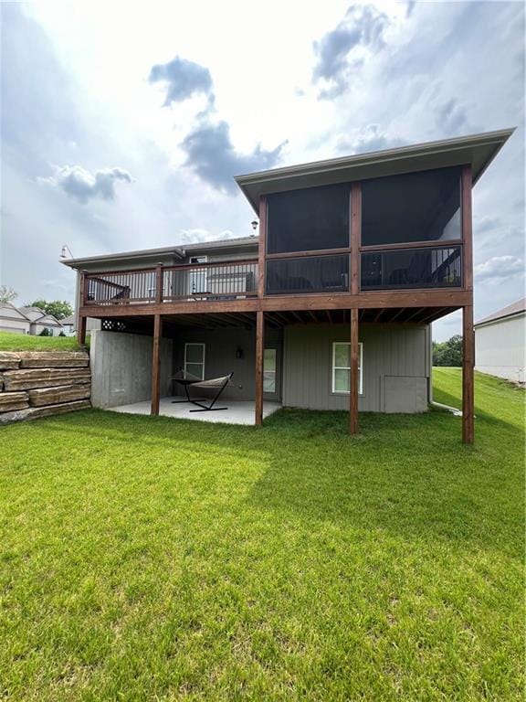 2321 Dovecott Dr, Kearney, MO 64060 - rear view of property featuring a deck, a lawn, and a patio