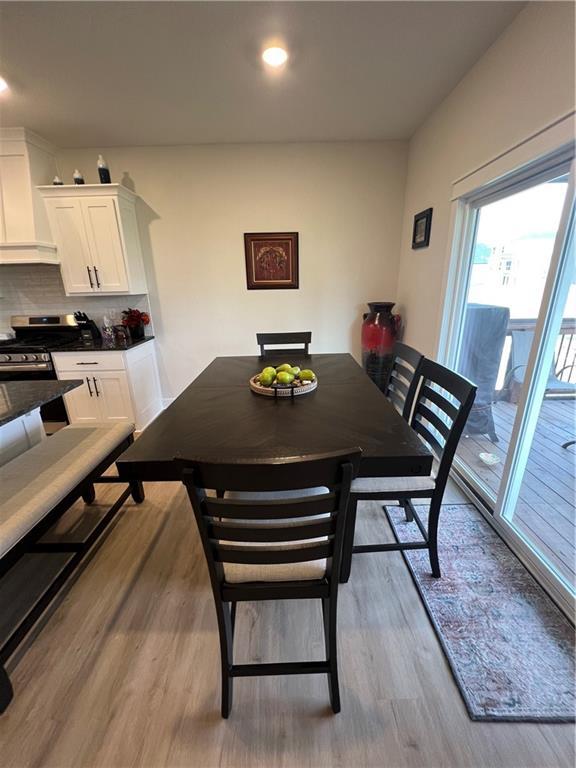 2321 Dovecott Dr, Kearney, MO 64060 - dining area featuring wood finished floors and recessed lighting