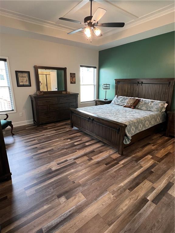 2321 Dovecott Dr, Kearney, MO 64060 - bedroom with dark wood-style flooring, ornamental molding, and ceiling fan
