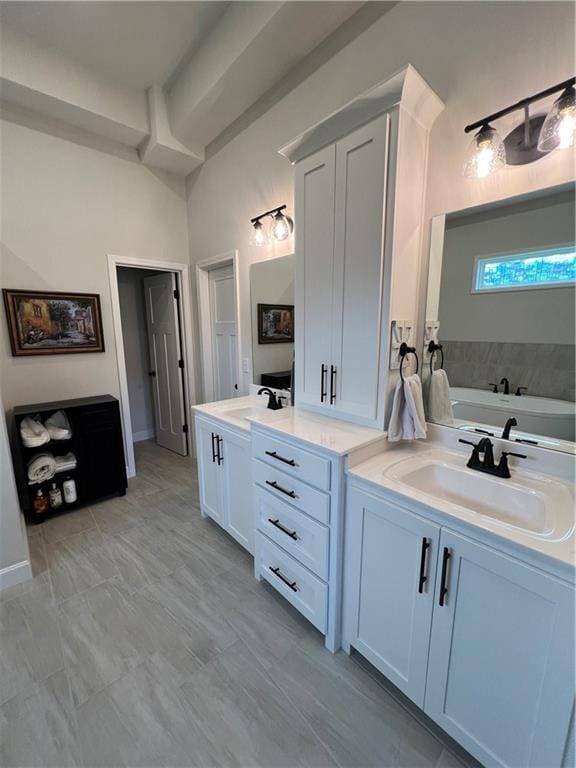 2321 Dovecott Dr, Kearney, MO 64060 - bathroom featuring two vanities and a bath