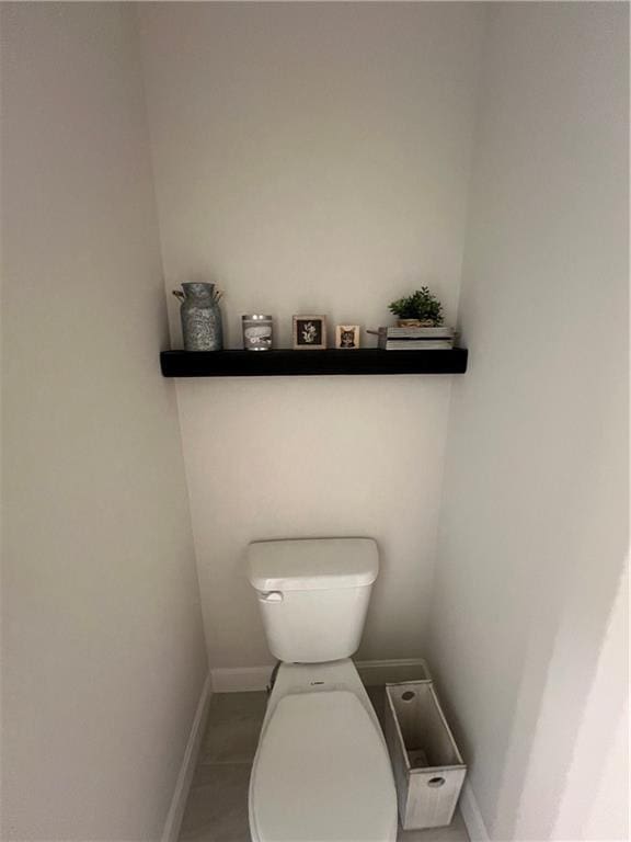2321 Dovecott Dr, Kearney, MO 64060 - bathroom with toilet and baseboards