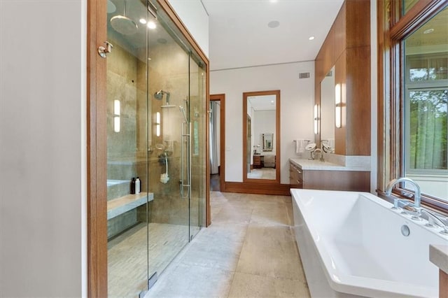2720 Verona Cir, Mission Hills, KS 66208 - full bath with a freestanding bath, a stall shower, vanity, tile patterned flooring, and ensuite bathroom