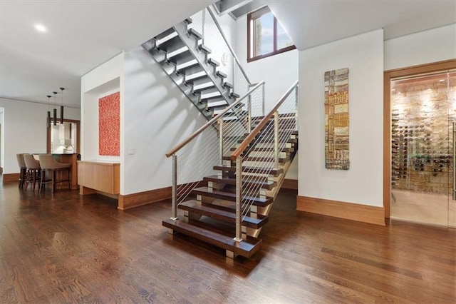 2720 Verona Cir, Mission Hills, KS 66208 - staircase with wood finished floors and recessed lighting