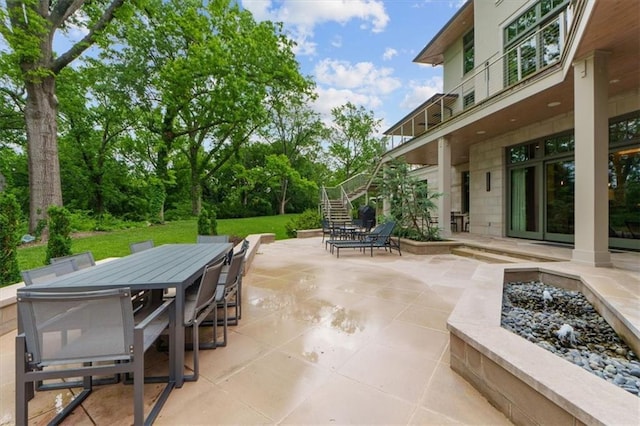 2720 Verona Cir, Mission Hills, KS 66208 - view of patio featuring stairs and outdoor dining space