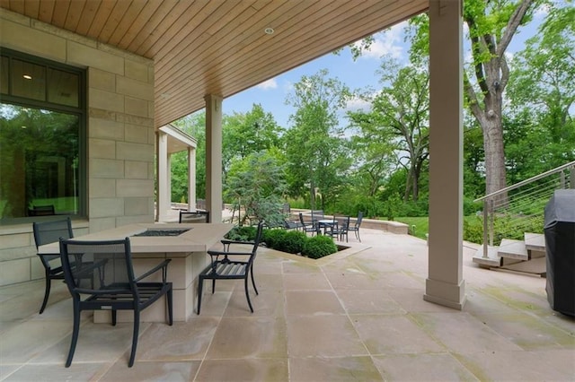 2720 Verona Cir, Mission Hills, KS 66208 - view of patio / terrace featuring outdoor dining space and view of wooded area
