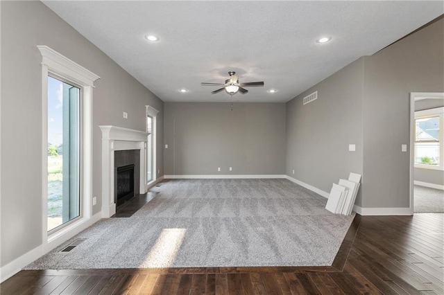 3726 NE 90th Ter, Kansas City, MO 64156 - unfurnished living room featuring ceiling fan, a premium fireplace, dark wood-style floors, and recessed lighting