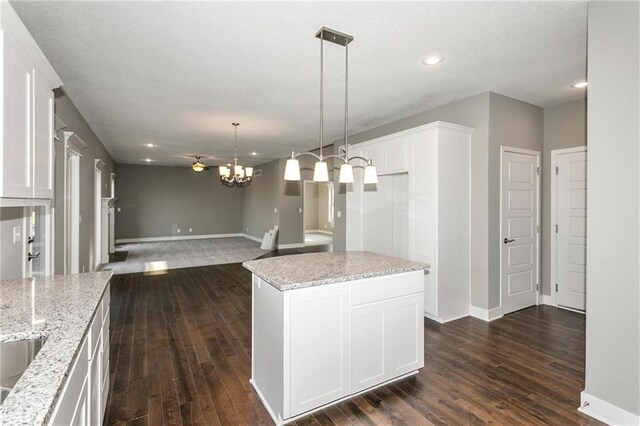 3726 NE 90th Ter, Kansas City, MO 64156 - kitchen featuring dark wood-style flooring, light stone counters, white cabinets, and recessed lighting