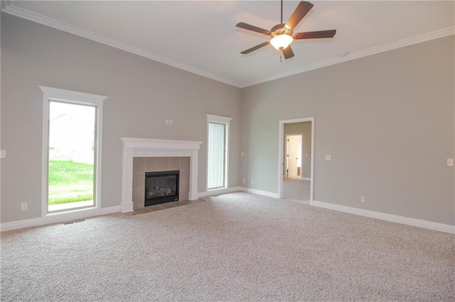 8911 N Monroe Ave, Kansas City, MO 64156 - unfurnished living room with a ceiling fan, carpet flooring, ornamental molding, and a fireplace