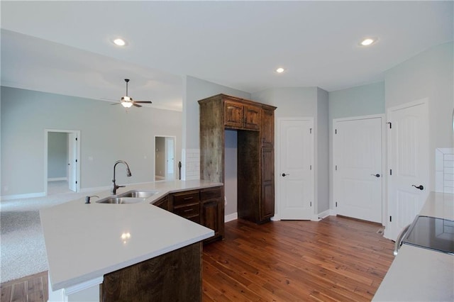 8911 N Monroe Ave, Kansas City, MO 64156 - kitchen with light countertops, ceiling fan, dark wood-style flooring, stove, and recessed lighting