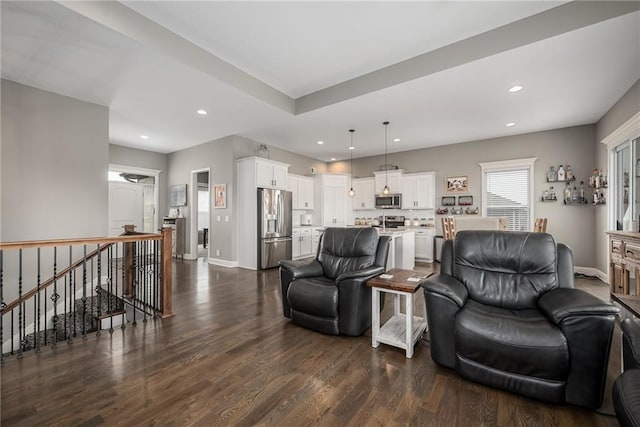14168 Nicollete Ct, Basehor, KS 66007 - living area with dark wood finished floors and recessed lighting
