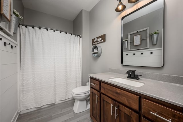 14168 Nicollete Ct, Basehor, KS 66007 - full bath featuring vanity, curtained shower, and wood finished floors