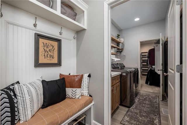 14168 Nicollete Ct, Basehor, KS 66007 - mudroom with washing machine and dryer, light wood-style floors, and recessed lighting