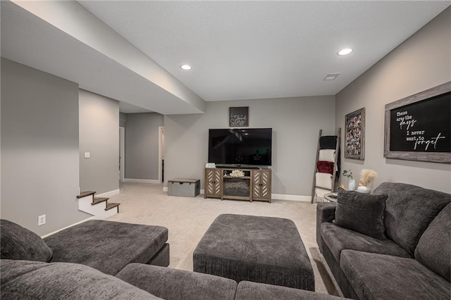 14168 Nicollete Ct, Basehor, KS 66007 - carpeted living area featuring stairs and recessed lighting