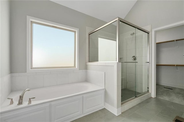 3720 NE 90th St, Kansas City, MO 64156 - full bath featuring a garden tub, a shower stall, a walk in closet, and tile patterned flooring