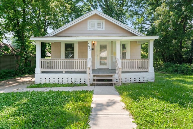 3640 Cleveland Ave, Kansas City, MO 64128 - bungalow-style home featuring covered porch