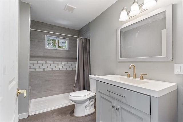 3640 Cleveland Ave, Kansas City, MO 64128 - bathroom featuring vanity and a tile shower