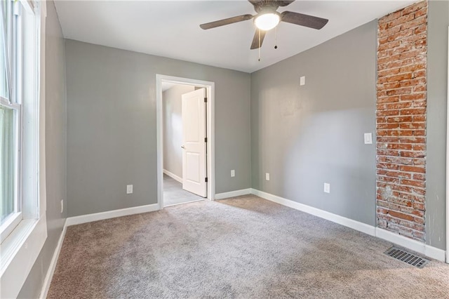 3640 Cleveland Ave, Kansas City, MO 64128 - unfurnished room with a ceiling fan and carpet flooring