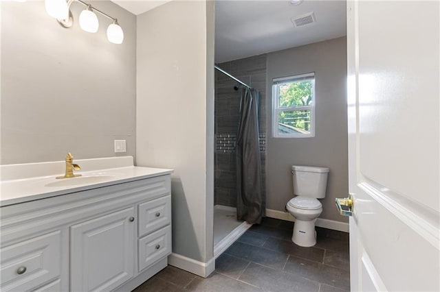 3640 Cleveland Ave, Kansas City, MO 64128 - bathroom with a tile shower, tile patterned flooring, and vanity