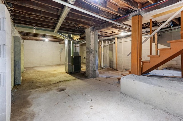 3640 Cleveland Ave, Kansas City, MO 64128 - unfinished below grade area with stairway and heating unit