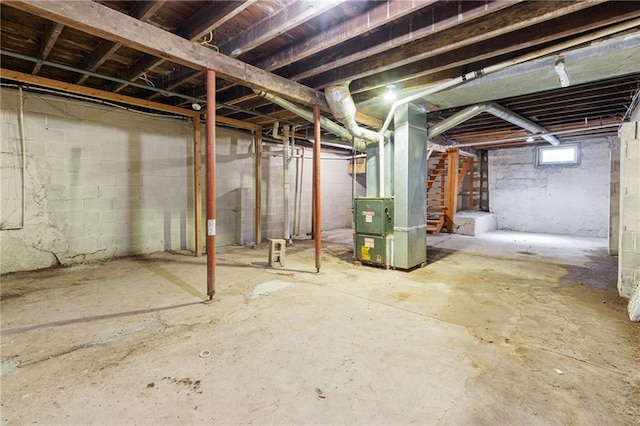 3640 Cleveland Ave, Kansas City, MO 64128 - below grade area with heating unit and stairway