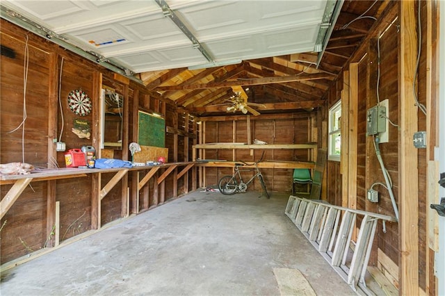 3640 Cleveland Ave, Kansas City, MO 64128 - garage featuring wooden walls