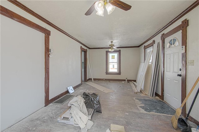 924 N Park Ave, Independence, MO 64050 - foyer entrance with ceiling fan, crown molding, and a textured ceiling