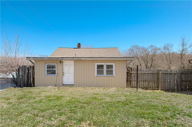 924 N Park Ave, Independence, MO 64050 - rear view of house with a fenced backyard and a chimney