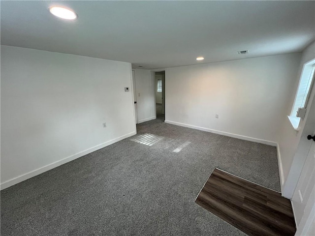 7104 N Cherry St, Gladstone, MO 64118 - unfurnished room with dark colored carpet and recessed lighting