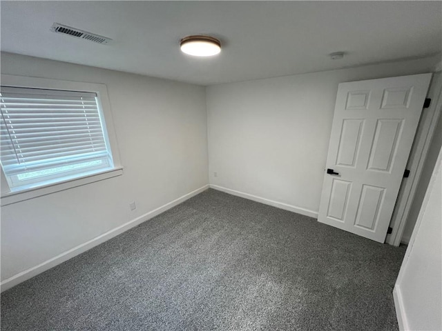 7104 N Cherry St, Gladstone, MO 64118 - carpeted spare room with baseboards