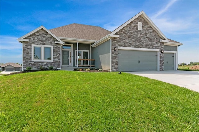 3707 NE 90th St, Kansas City, MO 64156 - view of front of home with stone siding, a garage, a front lawn, and concrete driveway