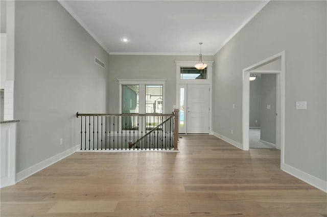 3707 NE 90th St, Kansas City, MO 64156 - entryway featuring ornamental molding, wood finished floors, and recessed lighting