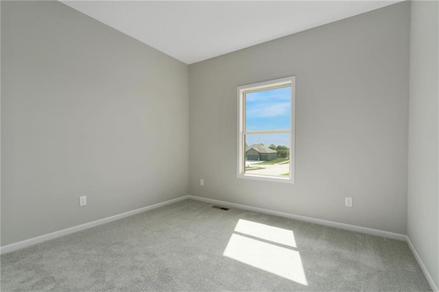 3707 NE 90th St, Kansas City, MO 64156 - carpeted spare room featuring baseboards
