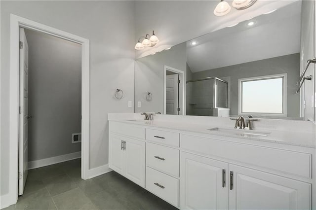 3707 NE 90th St, Kansas City, MO 64156 - bathroom featuring double vanity, an enclosed shower, vaulted ceiling, tile patterned floors, and recessed lighting