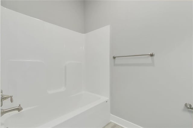 3707 NE 90th St, Kansas City, MO 64156 - bathroom with baseboards and shower / tub combination