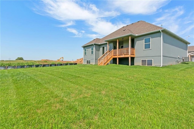 3707 NE 90th St, Kansas City, MO 64156 - back of property featuring a yard and stairs